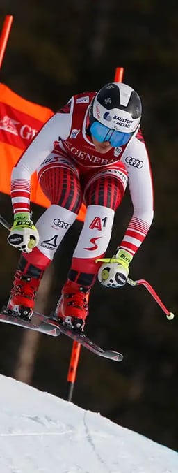 female skier going down hill